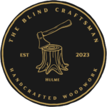 Logo of The Blind Craftsman featuring an axe and tree stump design.