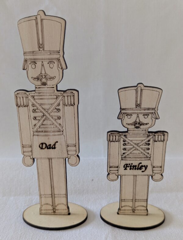 Personalised Nut Cracker Place Settings. Large 145x48mm. Small 103x48mm.