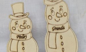 Personalised Snowman Place Settings. Adult size 130x50x2mm. Child size 100x50x2mm. £2 each.